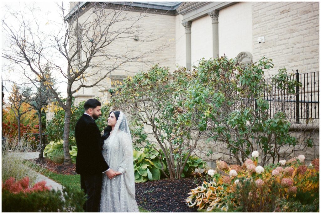 Pakistani bride and groom during their walima reception portraits at Château Le Jardin in Toronto, captured on film with soft, romantic light and timeless wedding photography.