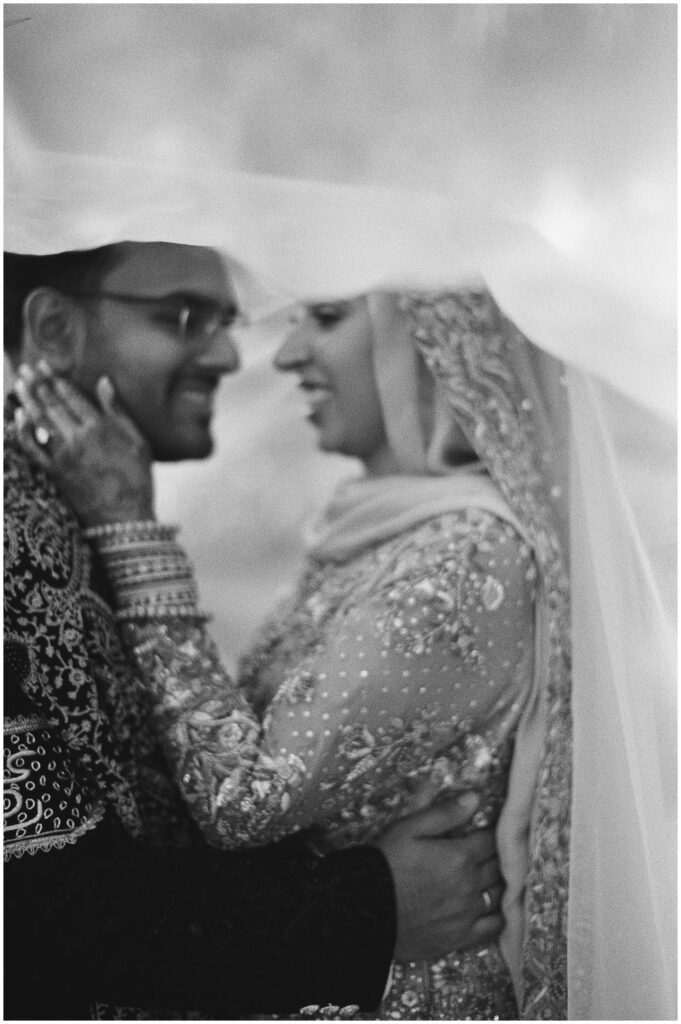 A joyful nikah moment filled with love and laughter, preserved on 35mm film.