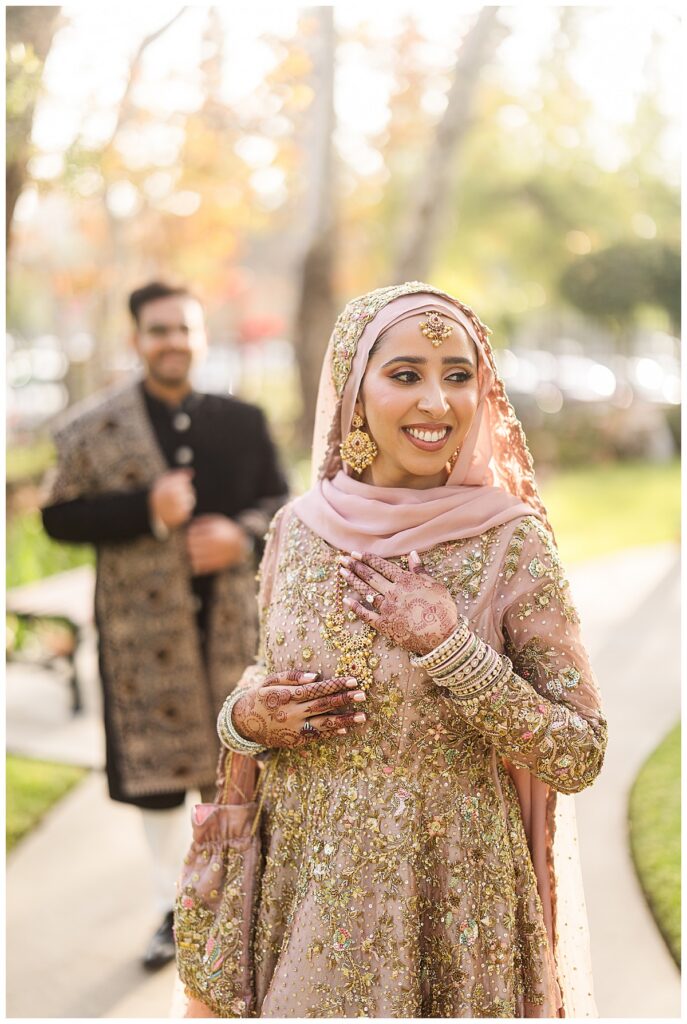 A pakistani couple during their couple portraits at their outdoor nikkah