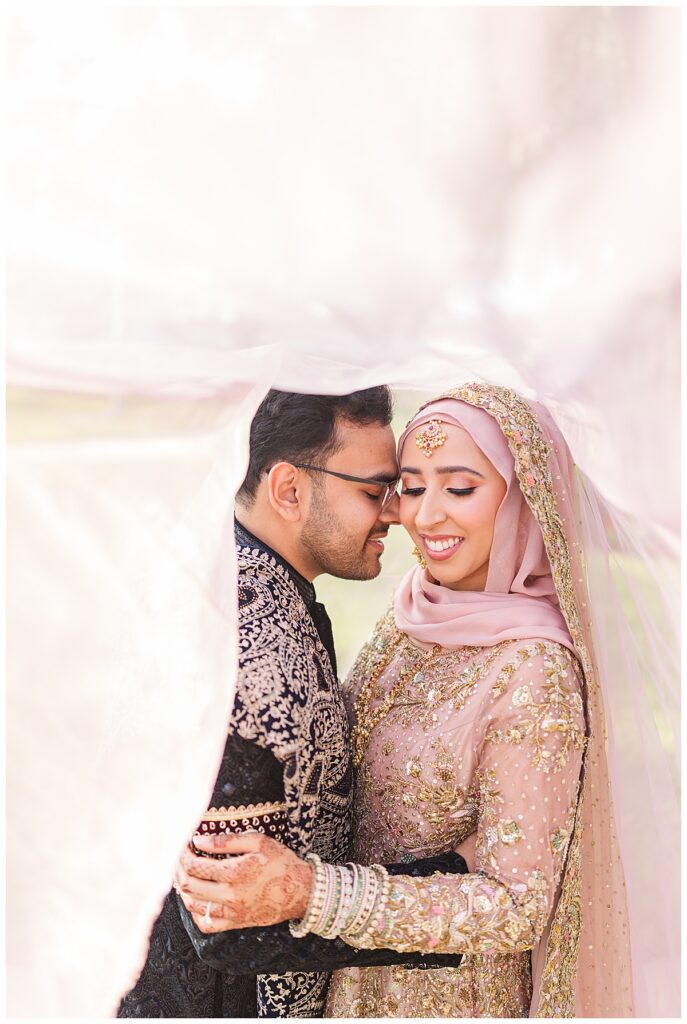 A pakistani couple during their couple portraits at their outdoor nikkah