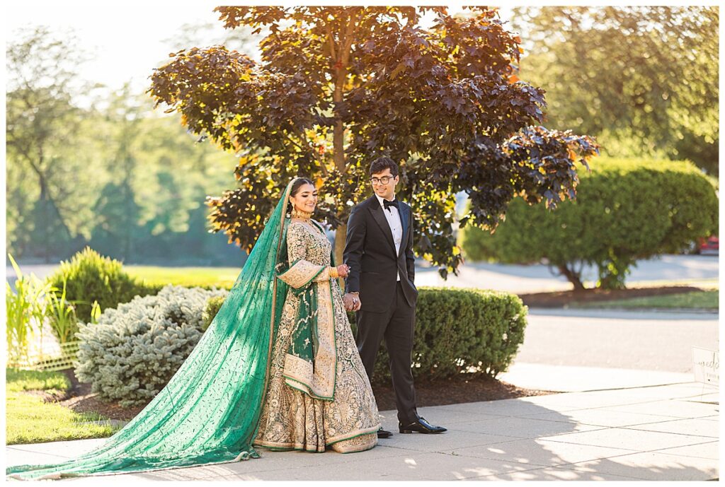 Pakistani bride and groom posing for Valima portraits at AKG Museum in Buffalo NY Buffalo History Museum