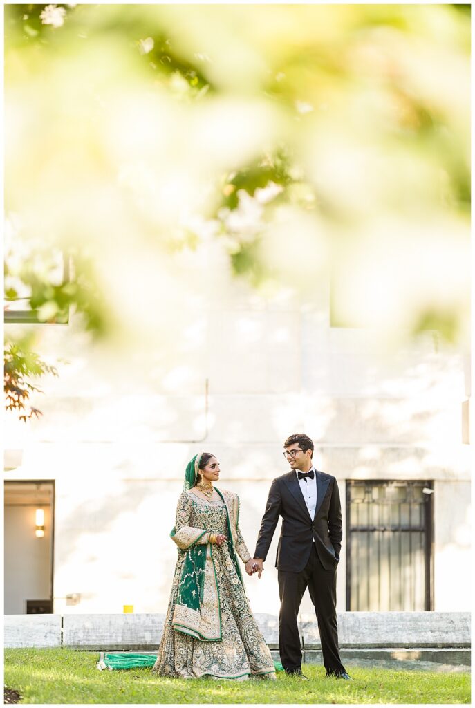 Pakistani bride and groom posing for Valima portraits at AKG Museum in Buffalo NY Buffalo History Museum