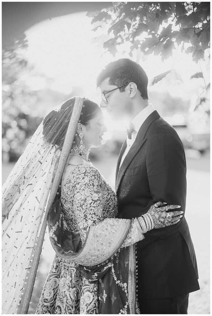 Pakistani bride and groom posing for Valima portraits at AKG Museum in Buffalo NY Buffalo History Museum