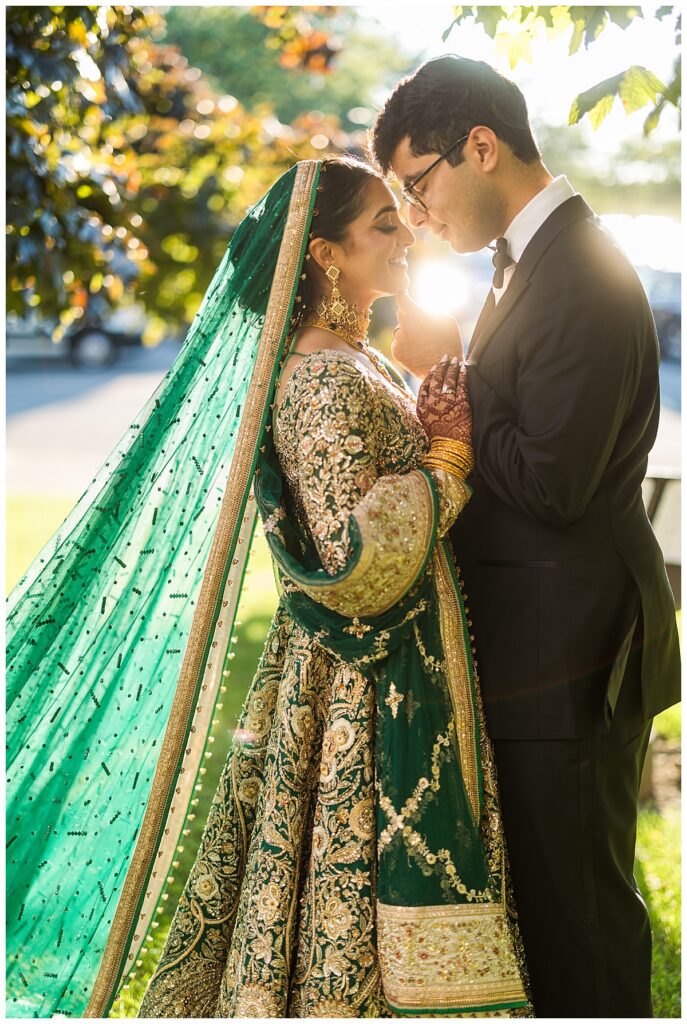 Pakistani bride and groom posing for Valima portraits at AKG Museum in Buffalo NY Buffalo History Museum
